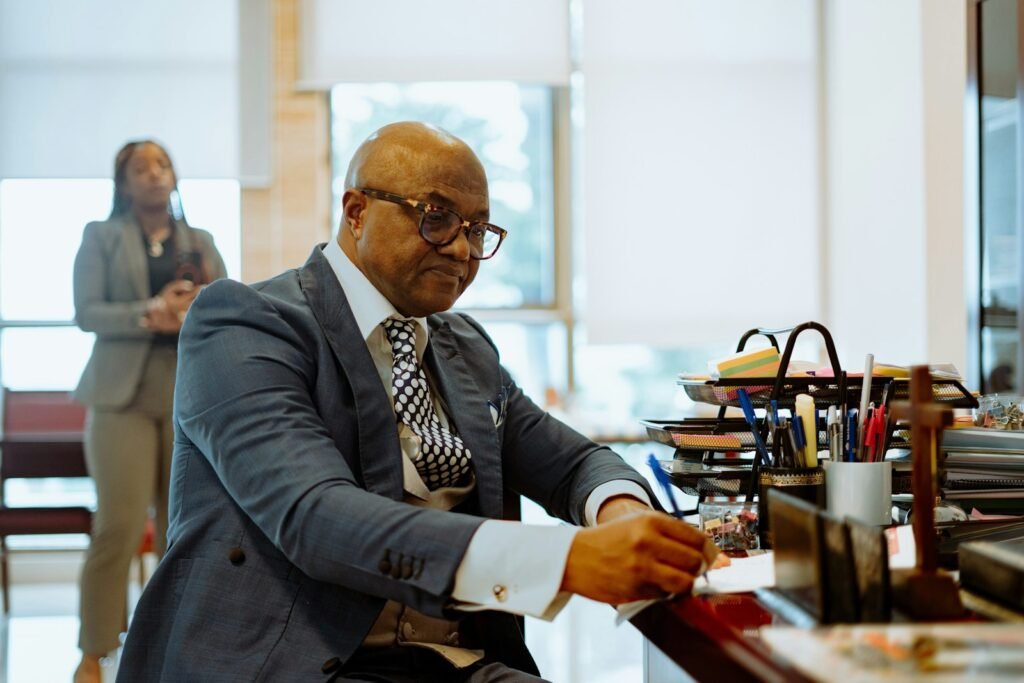Lawyer in a suit writing at a desk