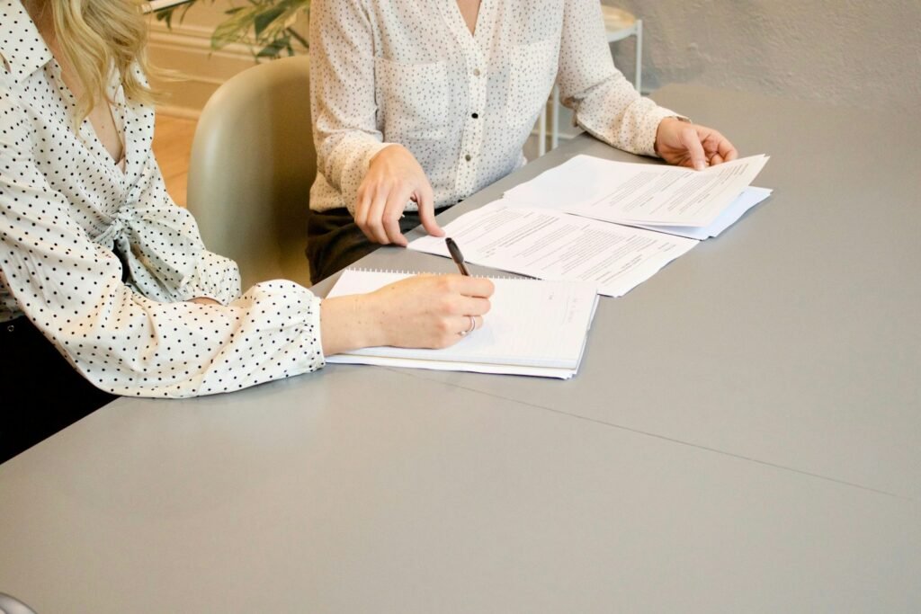 Woman signing a legal document